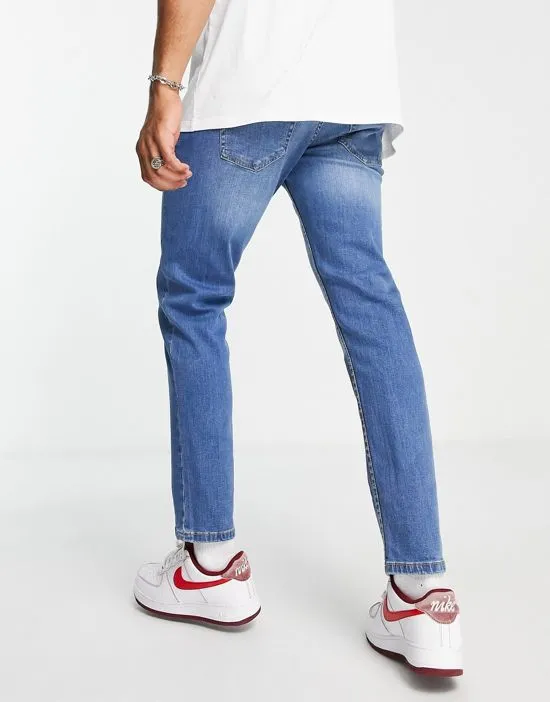 https://images.styletyx.com/images/dtt-slim-fit-jeans-in-mid-blue-don-t-think-twice-13521785_3.webp
