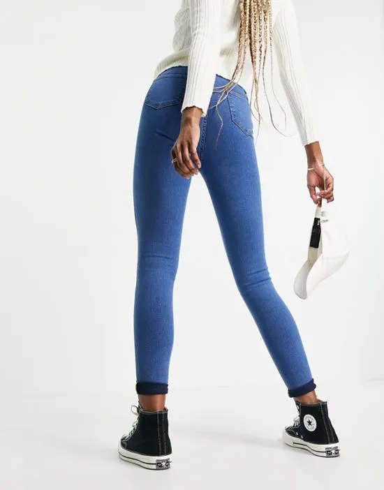 https://images.styletyx.com/images/dtt-tall-chloe-high-waisted-disco-stretch-skinny-jeans-in-mid-wash-blue-don-t-think-twice-tall-1926381_2.webp