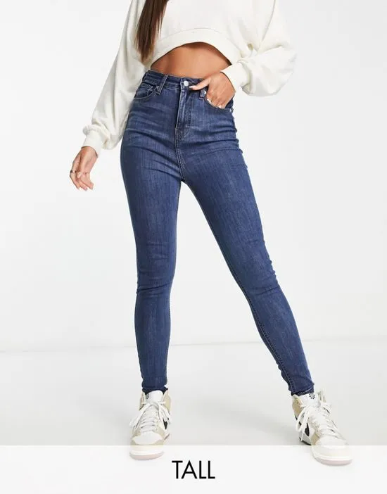 https://images.styletyx.com/images/dtt-tall-ellie-high-waisted-skinny-jeans-in-mid-blue-don-t-think-twice-tall-13285836_1.webp