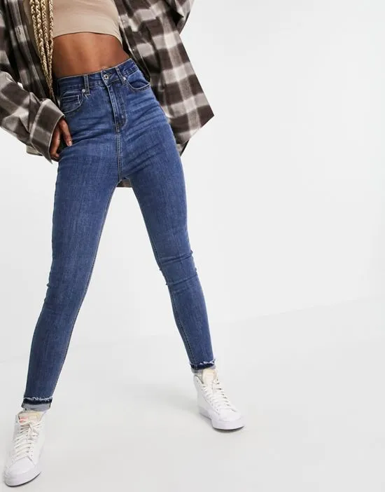 https://images.styletyx.com/images/dtt-tall-ellie-high-waisted-skinny-jeans-in-mid-blue-don-t-think-twice-tall-1921970_3.webp