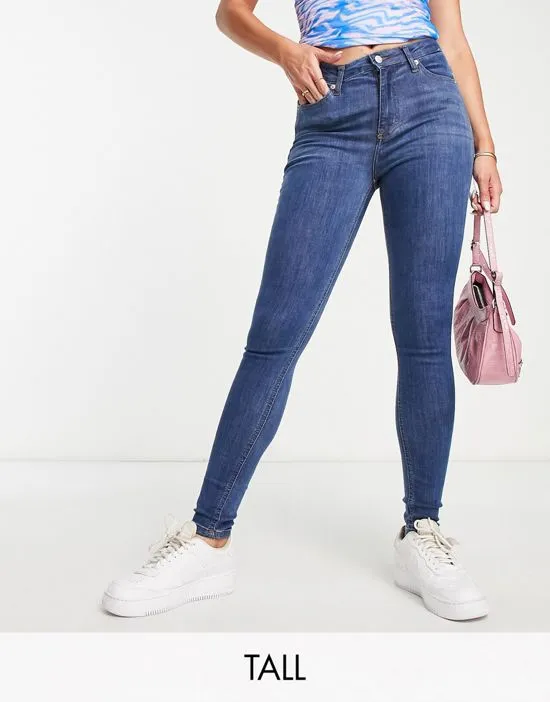 https://images.styletyx.com/images/dtt-tall-jo-mid-rise-skinny-jeans-in-mid-blue-wash-don-t-think-twice-tall-2718372_1.webp