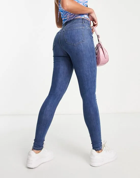 https://images.styletyx.com/images/dtt-tall-jo-mid-rise-skinny-jeans-in-mid-blue-wash-don-t-think-twice-tall-2718372_2.webp