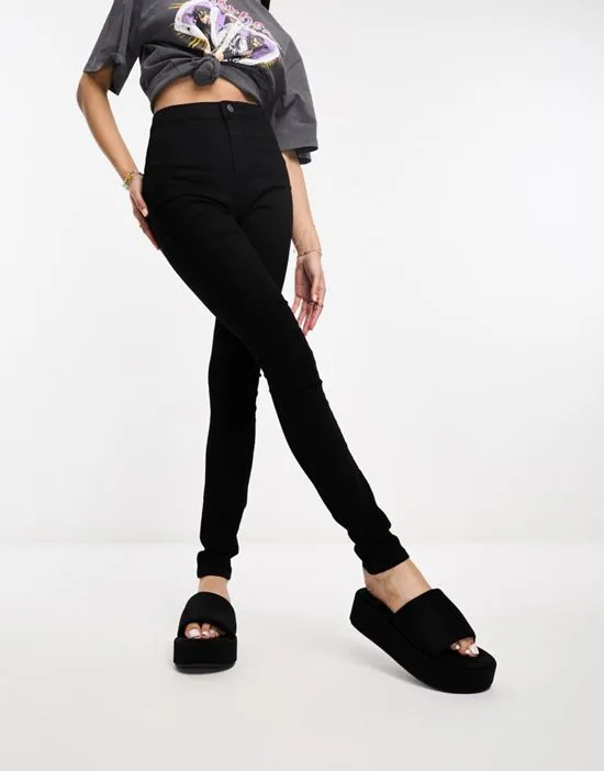 https://images.styletyx.com/images/ella-super-high-waist-skinny-jeans-in-black-noisy-may-1004948936_3.webp