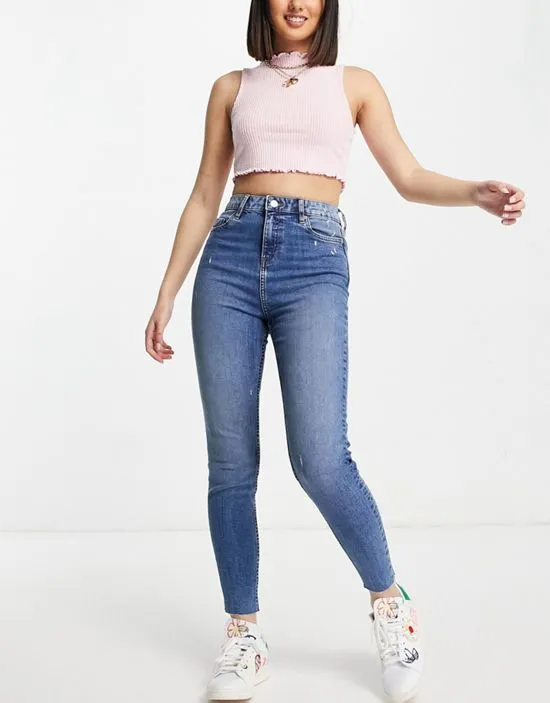 https://images.styletyx.com/images/emily-high-waist-ankle-grazer-skinny-jean-in-midwash-blue-miss-selfridge-2940178_3.webp