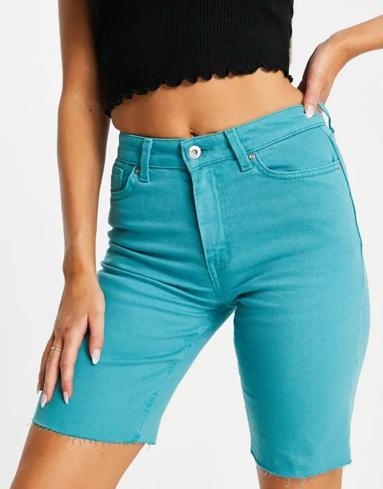 https://images.styletyx.com/images/emily-raw-hem-longline-denim-shorts-in-turquoise-only-2871174_3.webp