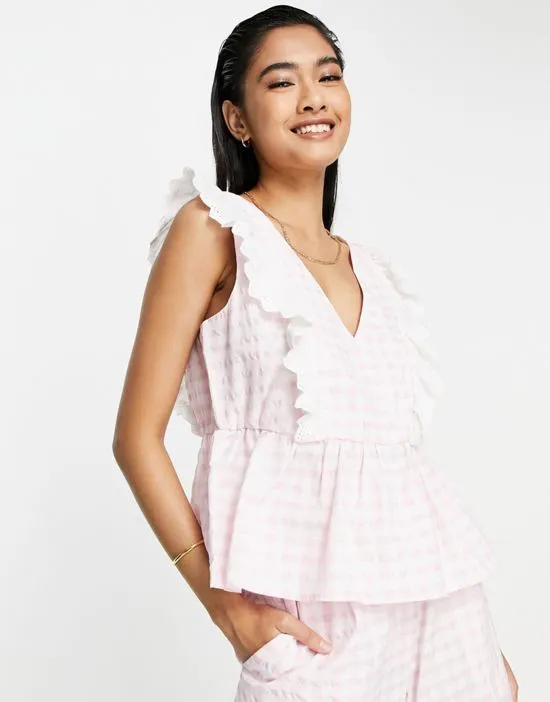 https://images.styletyx.com/images/exclusive-gingham-fril-top-in-pink-part-of-a-set-y-a-s-1882279_1.webp