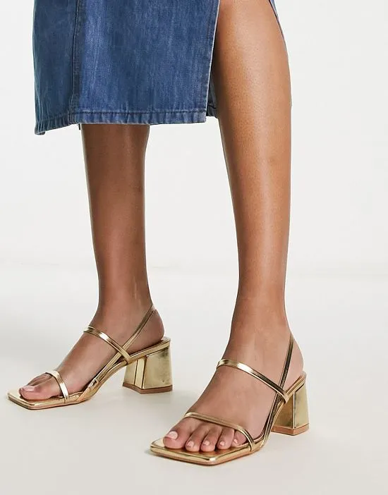 https://images.styletyx.com/images/exclusive-just-realise-strappy-mid-heel-sandals-in-gold-public-desire-13315437_1.webp