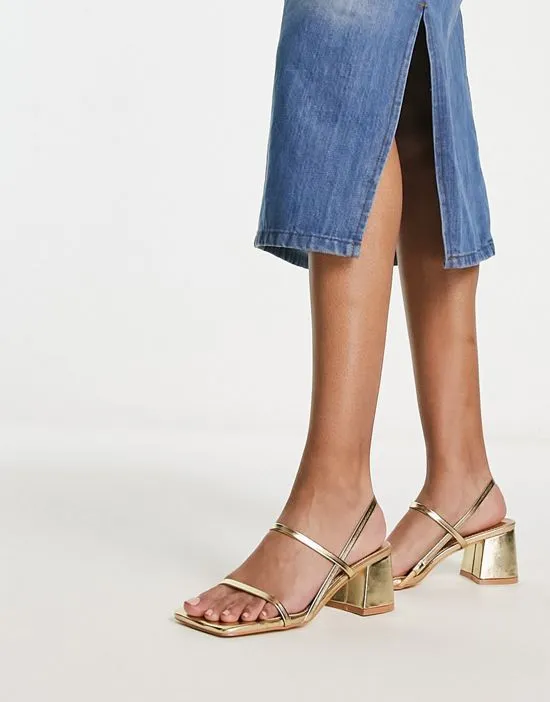 https://images.styletyx.com/images/exclusive-just-realise-strappy-mid-heel-sandals-in-gold-public-desire-13315437_3.webp