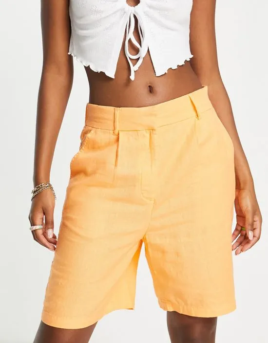 https://images.styletyx.com/images/exclusive-linen-city-shorts-in-orange-only-2240125_3.webp