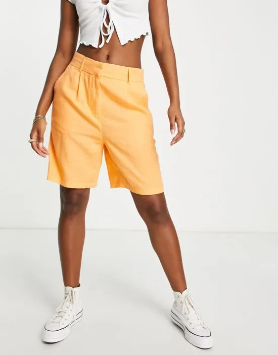 https://images.styletyx.com/images/exclusive-linen-city-shorts-in-orange-only-2240125_4.webp
