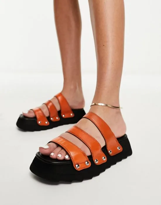 https://images.styletyx.com/images/exclusive-sabian-3-strap-chunky-slide-sandals-in-orange-leather-asra-873976239_2.webp