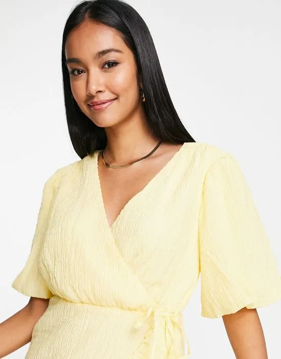 https://images.styletyx.com/images/exclusive-textured-mini-dress-with-ruffle-seam-detail-in-pastel-yellow-vila-1823178_3.webp