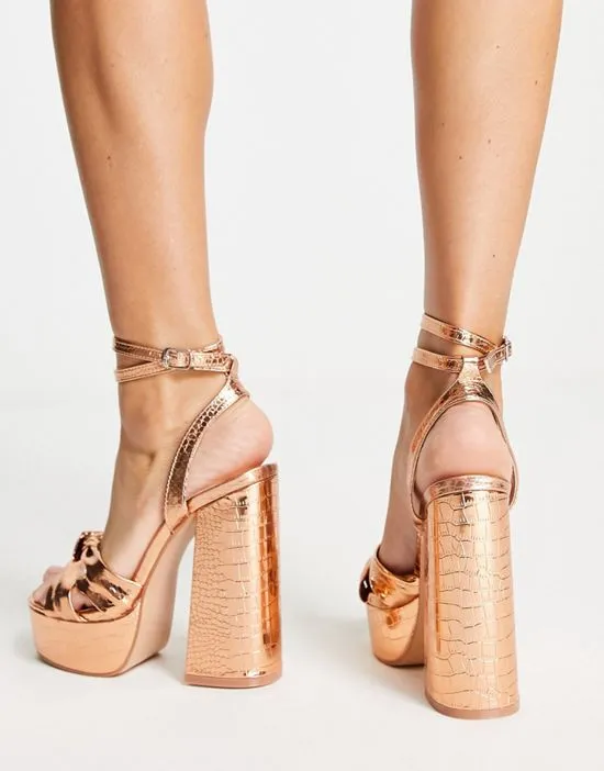 https://images.styletyx.com/images/exclusive-verona-platform-high-heel-sandals-in-rose-gold-public-desire-3112681_2.webp