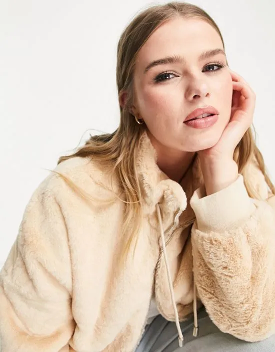 https://images.styletyx.com/images/faux-fur-bomber-jacket-in-tan-tan-missguided-plus-2595002_3.webp