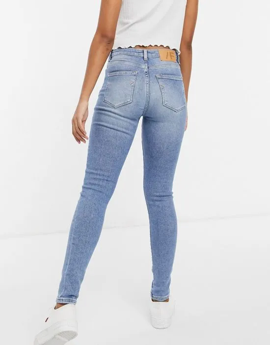 https://images.styletyx.com/images/femme-sophia-cotton-blend-skinny-jeans-in-mid-blue-wash-mblue-selected-2789147_2.webp