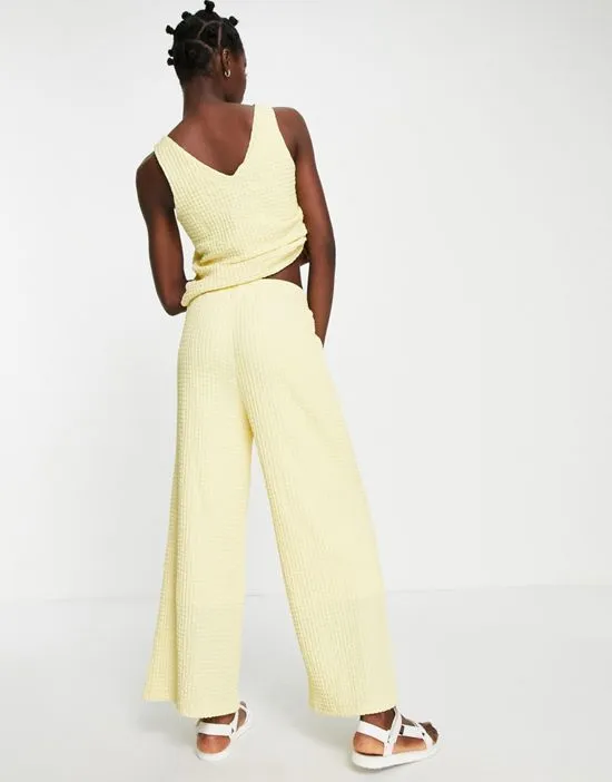 https://images.styletyx.com/images/femme-textured-wide-leg-pants-in-pastel-yellow-part-of-a-set-yellow-selected-3140168_2.webp