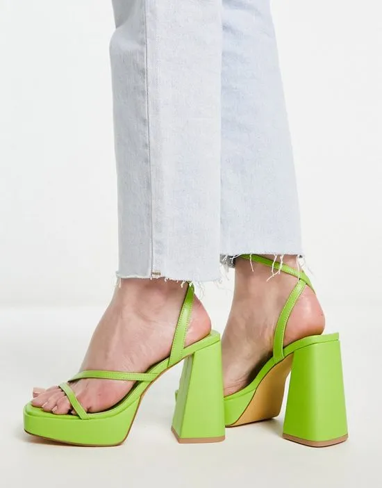 https://images.styletyx.com/images/flare-heeled-platform-sandals-in-lime-london-rebel-wide-fit-433289203_2.webp