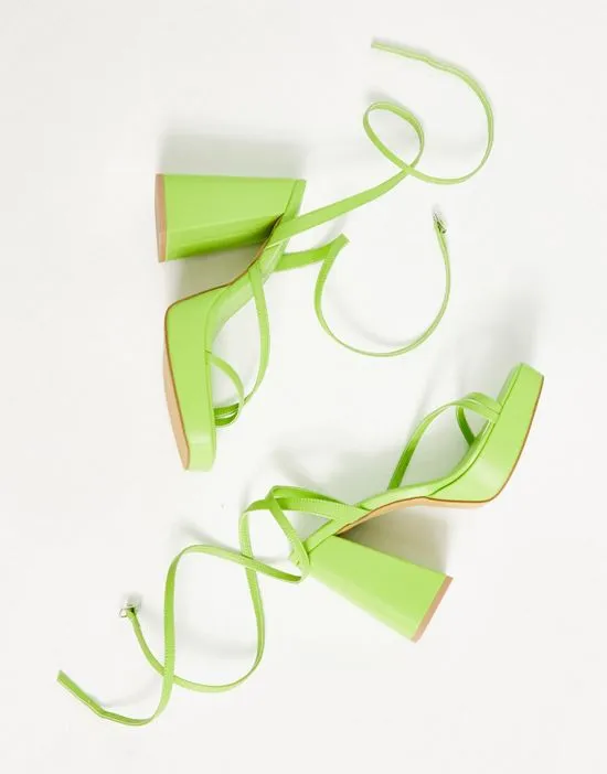 https://images.styletyx.com/images/flare-heeled-platform-sandals-in-lime-london-rebel-wide-fit-433289203_4.webp