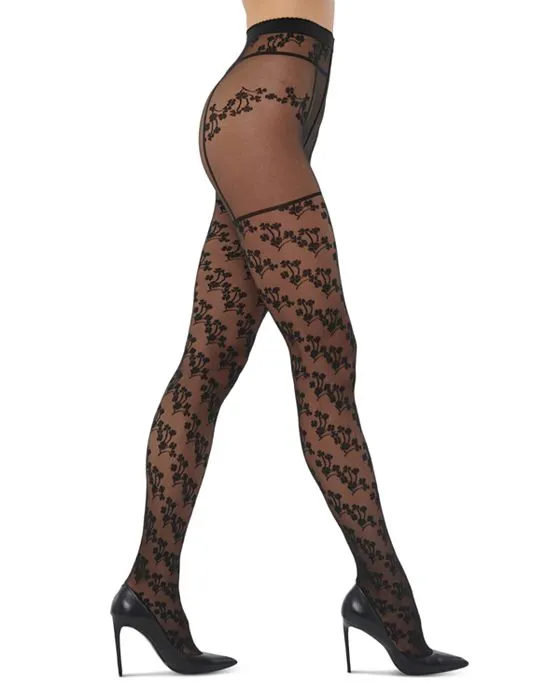 https://images.styletyx.com/images/floral-suspender-tights-wolford-13207695_3.webp