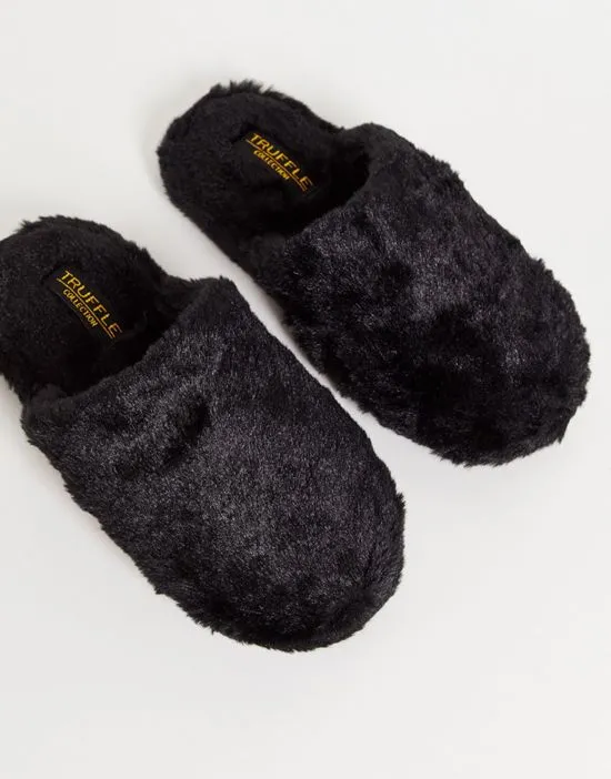 https://images.styletyx.com/images/fluffy-mule-slipper-in-black-truffle-collection-2742531_1.webp