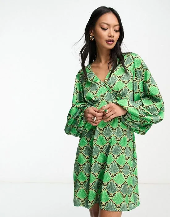 https://images.styletyx.com/images/fluted-sleeve-mini-dress-in-green-print-never-fully-dressed-13209418_2.webp