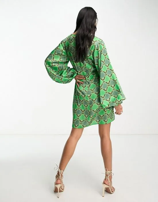 https://images.styletyx.com/images/fluted-sleeve-mini-dress-in-green-print-never-fully-dressed-13209418_3.webp