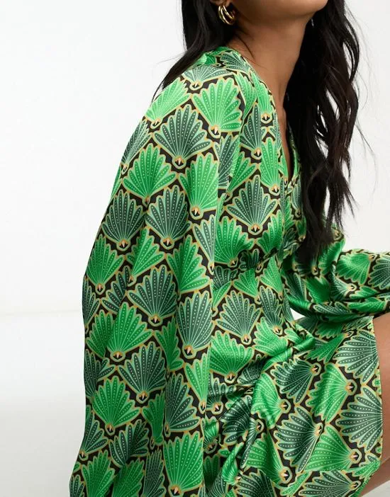 https://images.styletyx.com/images/fluted-sleeve-mini-dress-in-green-print-never-fully-dressed-13209418_4.webp