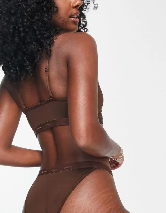 https://images.styletyx.com/images/form-to-body-unlined-bralette-with-tonal-logo-in-umber-calvin-klein-1846878_3.webp