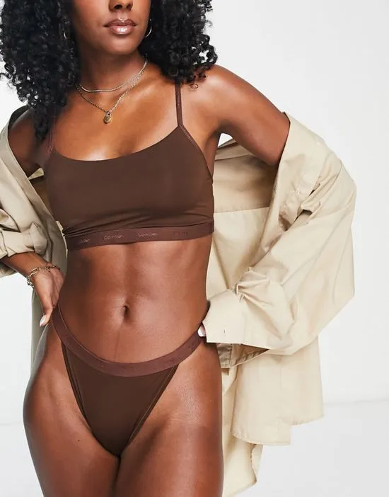 https://images.styletyx.com/images/form-to-body-unlined-bralette-with-tonal-logo-in-umber-calvin-klein-1846878_4.webp