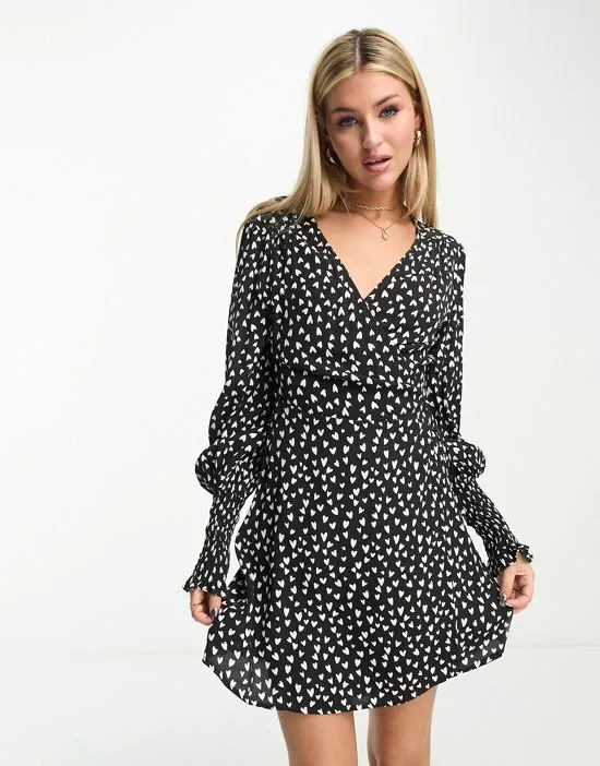 https://images.styletyx.com/images/franco-printed-heart-wrap-dress-in-black-charlie-holiday-13240972_1.webp