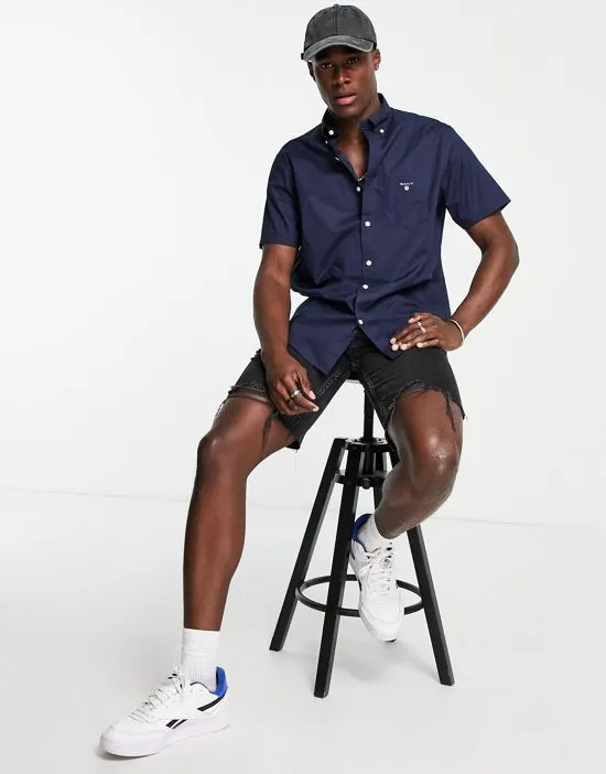 https://images.styletyx.com/images/gant-icon-logo-regular-fit-short-sleeve-broadcloth-shirt-in-navy-gant-2475804_3.webp