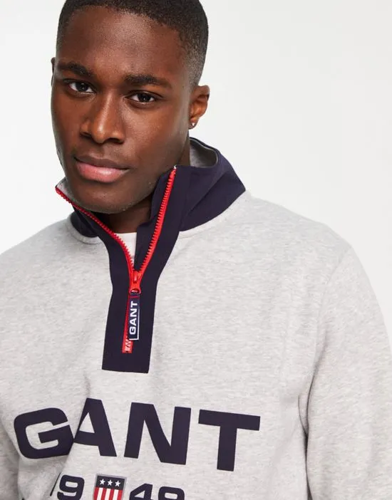 https://images.styletyx.com/images/gant-retro-logo-half-zip-sweatshirt-in-gray-heather-gant-13664157_4.webp