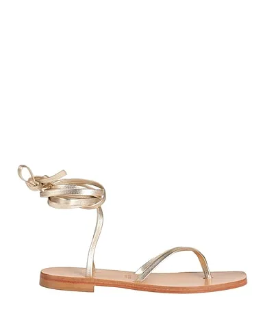 https://images.styletyx.com/images/gold-leather-flip-flops-via-krupp-13006387_1.webp