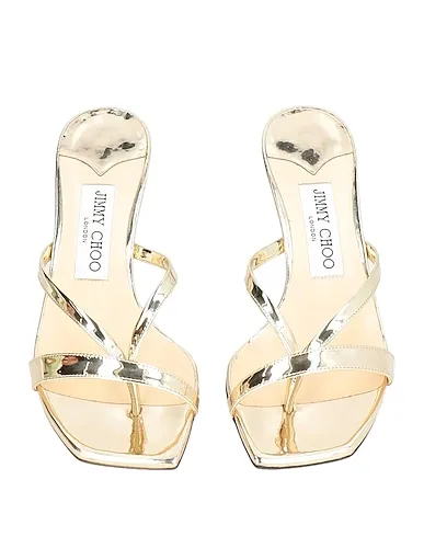 https://images.styletyx.com/images/gold-leather-sandals-jimmy-choo-1910630498_4.webp