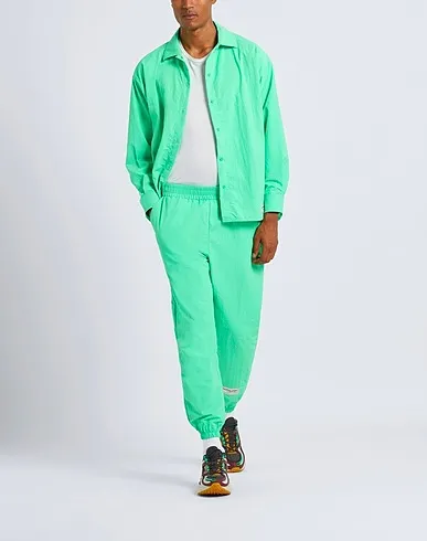 https://images.styletyx.com/images/green-techno-fabric-casual-pants-the-giving-movement-x-yoox-13577747_2.webp