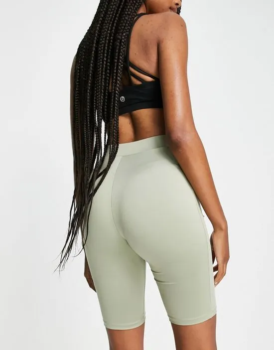 https://images.styletyx.com/images/gym-legging-shorts-in-sage-green-hoxton-haus-tall-1946170_2.webp