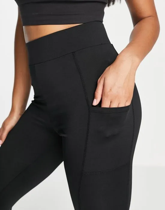 https://images.styletyx.com/images/gym-leggings-with-pocket-detail-in-black-threadbare-fitness-2805207_3.webp