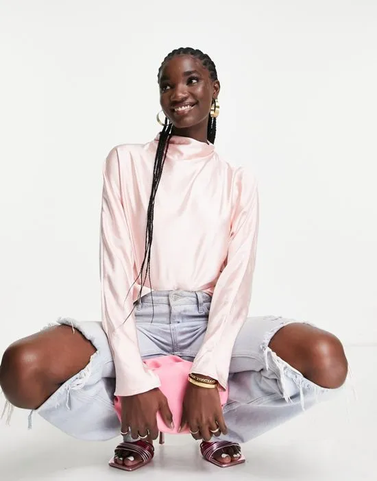 https://images.styletyx.com/images/high-neck-backless-blouse-in-blush-pink-pretty-lavish-1882214_2.webp