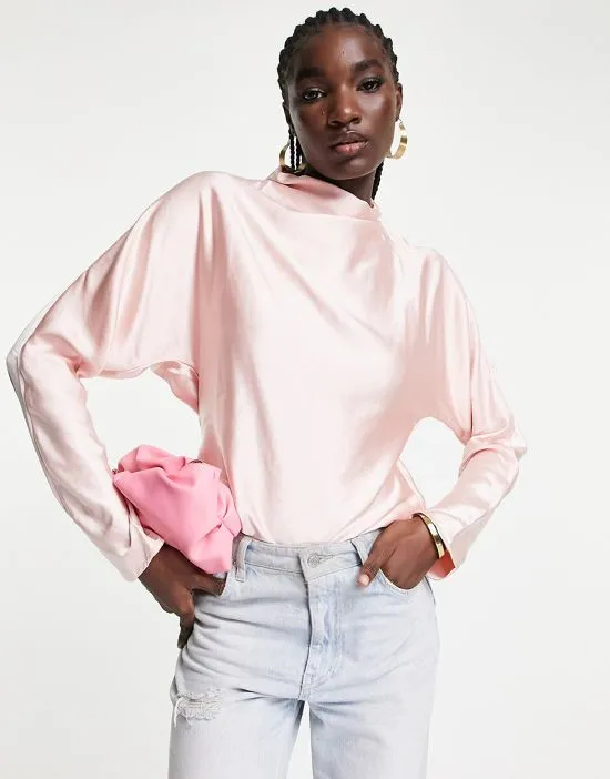 https://images.styletyx.com/images/high-neck-backless-blouse-in-blush-pink-pretty-lavish-1882214_3.webp