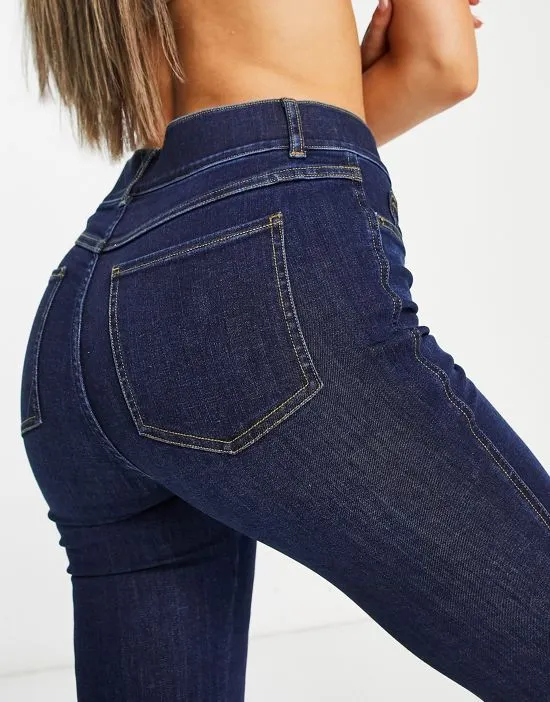 https://images.styletyx.com/images/high-rise-flare-jeans-in-dark-wash-spanx-1905704835_3.webp