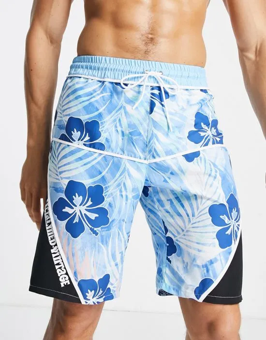 https://images.styletyx.com/images/inspired-swim-board-shorts-in-blue-hawaiian-print-reclaimed-vintage-2215215_3.webp