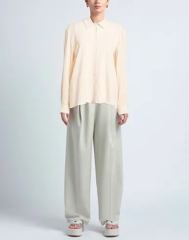https://images.styletyx.com/images/ivory-crepe-solid-color-shirts-blouses-angela-davis-1535242313_2.webp