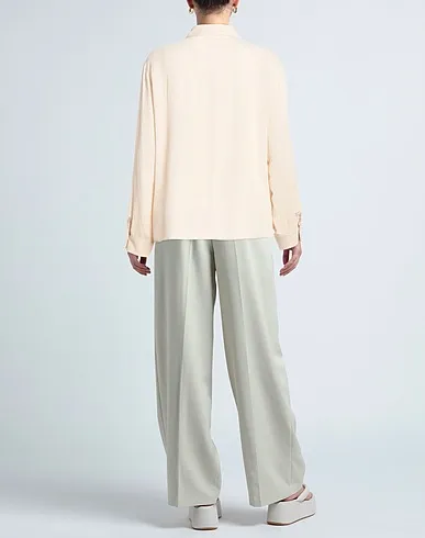 https://images.styletyx.com/images/ivory-crepe-solid-color-shirts-blouses-angela-davis-1535242313_3.webp