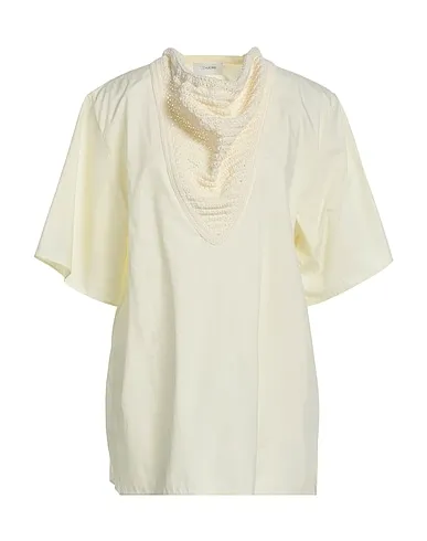 https://images.styletyx.com/images/ivory-knitted-blouse-lemaire-3180005_1.webp