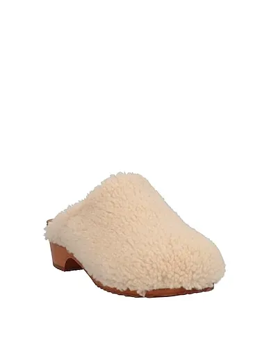 https://images.styletyx.com/images/ivory-mules-and-clogs-figure-decorative-3210139_2.webp