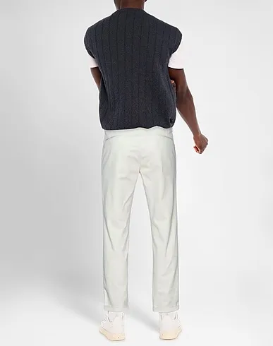 https://images.styletyx.com/images/ivory-plain-weave-casual-pants-luca-bertelli-1461155_3.webp