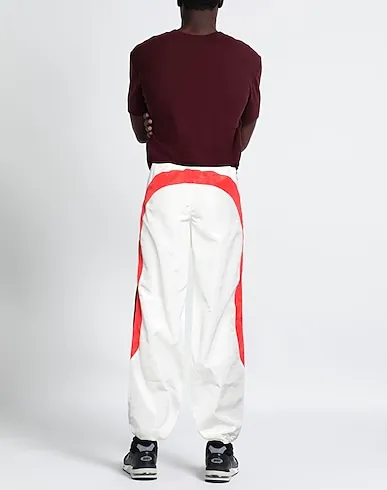 https://images.styletyx.com/images/ivory-techno-fabric-casual-pants-marine-serre-13301382_3.webp
