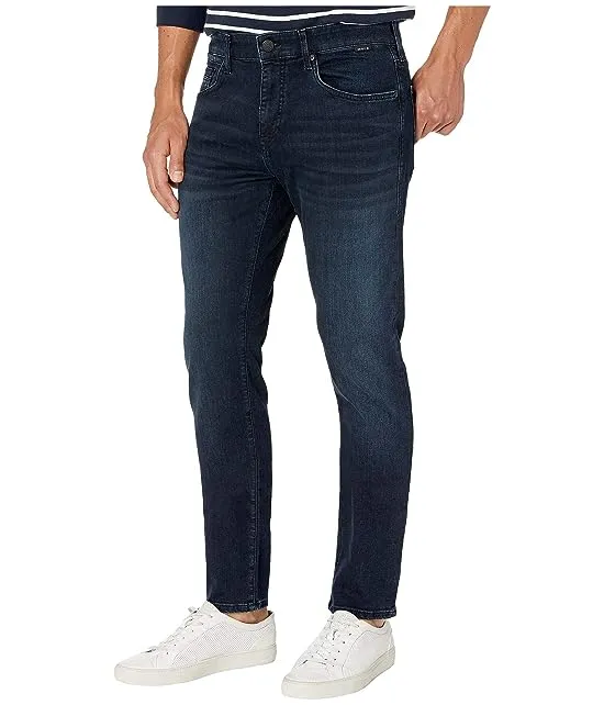 https://images.styletyx.com/images/jake-regular-rise-slim-leg-in-deep-blue-black-williamsburg-mavi-jeans-13642567_2.webp