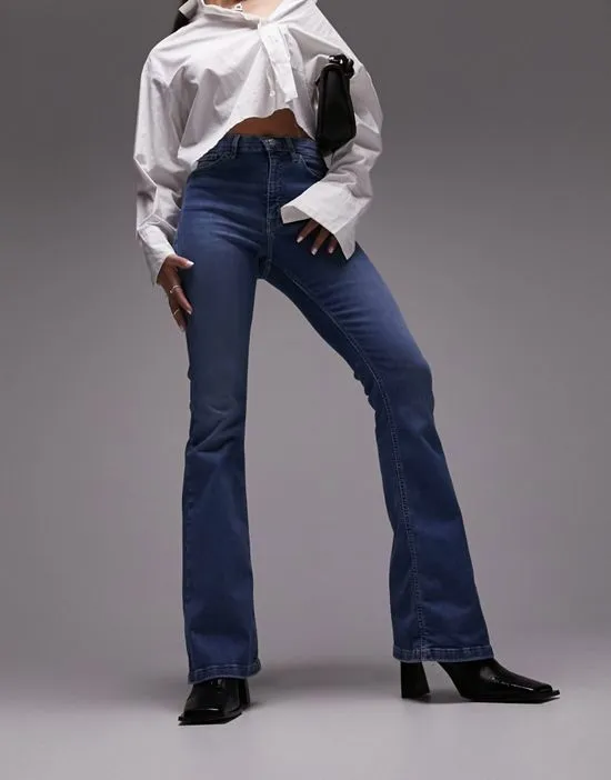 https://images.styletyx.com/images/jamie-flare-jeans-in-mid-blue-topshop-hourglass-3269554_3.webp
