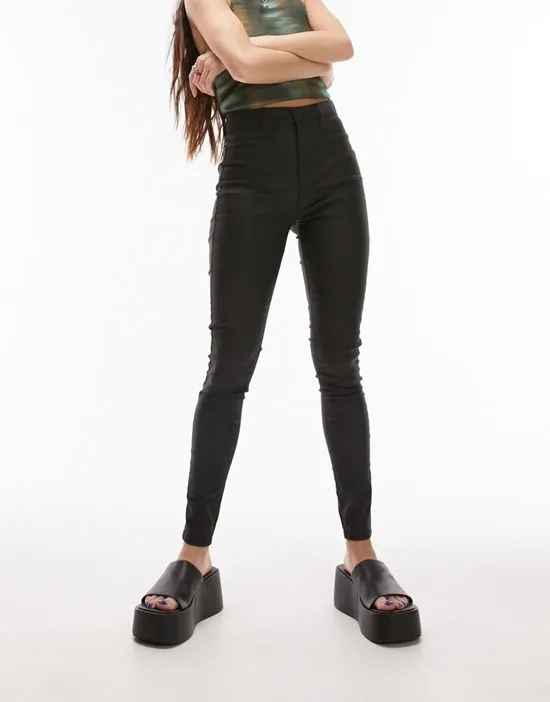 https://images.styletyx.com/images/joni-jeans-in-coated-black-topshop-3228594_1.webp
